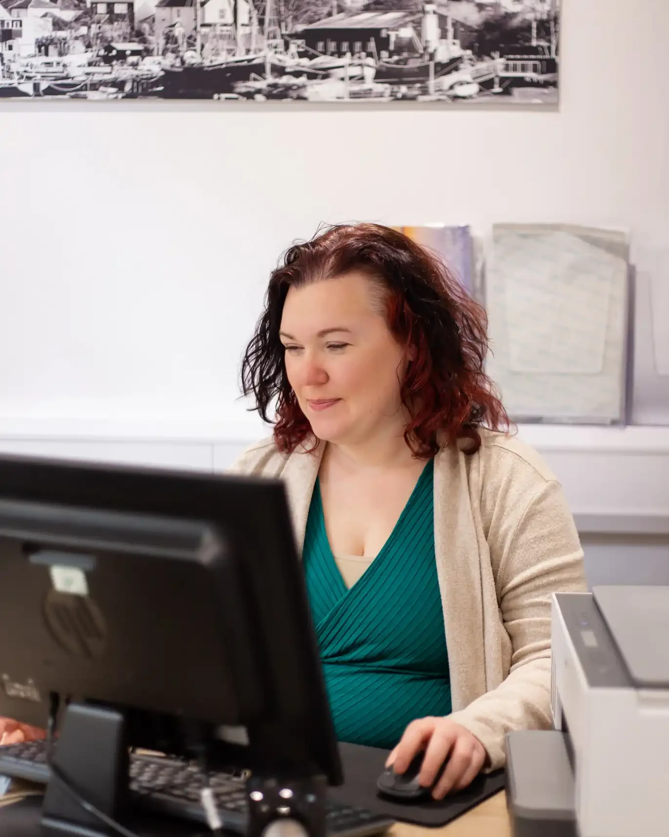 Helena Clinkscales, founder of Optimised Office, working at her desk